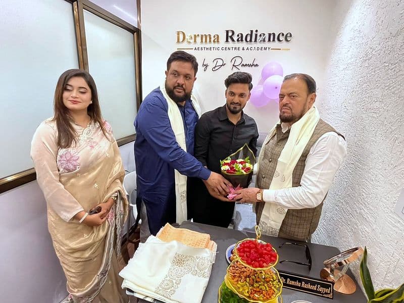Guests presenting flowers at the grand opening