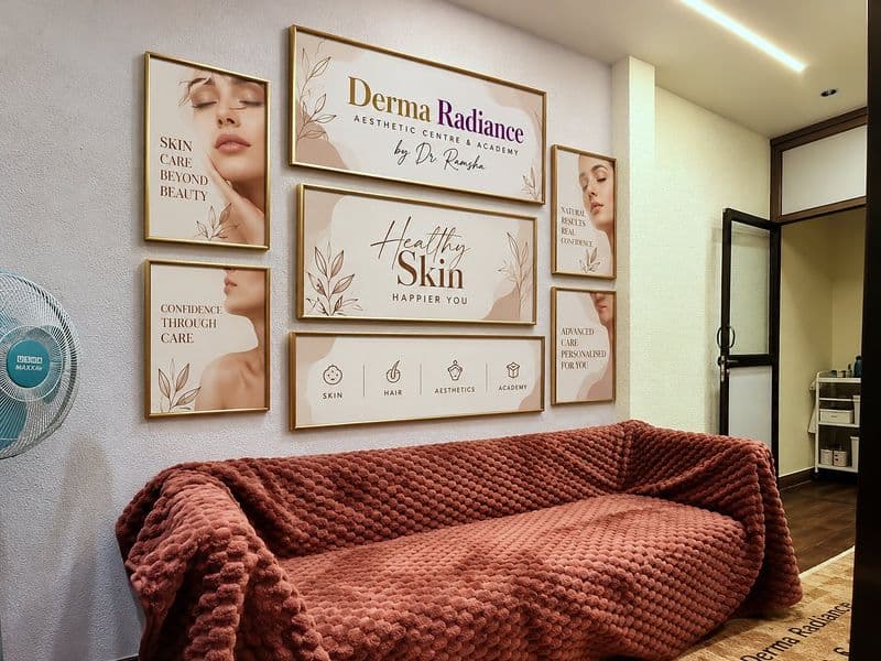 Waiting area with framed artwork above the sofa