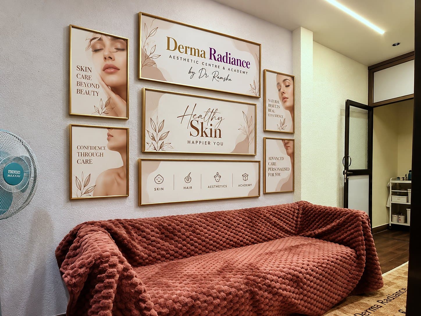 Waiting area with framed artwork above the sofa